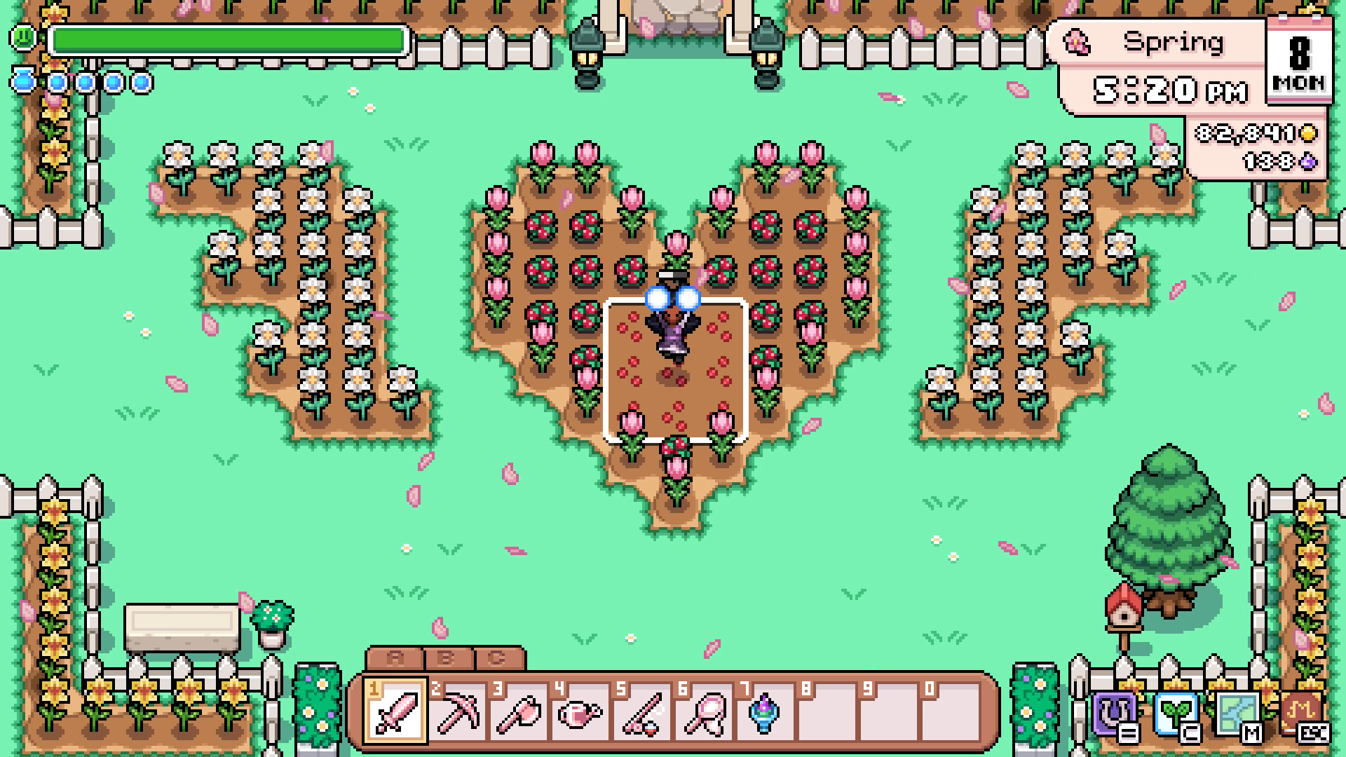 The player casting the Growth spell over a heart-shaped strawberry field in Fields of Mistria.